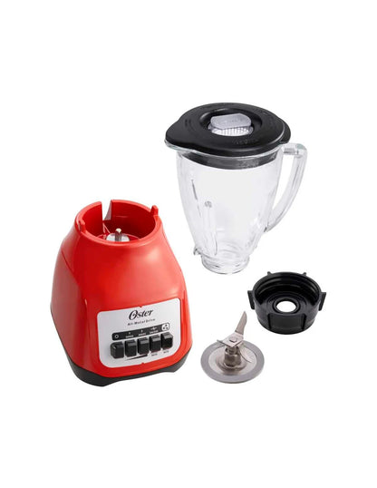Licuadora Oster Kaliman roja con base 550W, vaso de vidrio transparente y tapa negra desmontable.
