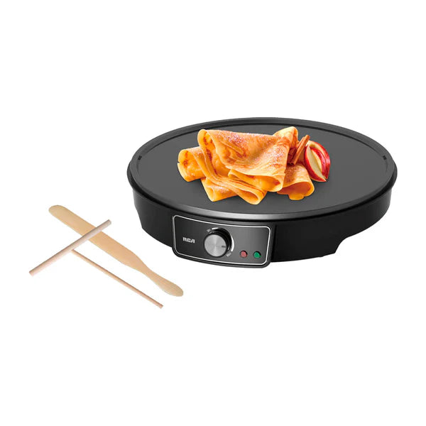 Crepera eléctrica antiadherente negra de 30 cm con control de temperatura y crepes dorados servidos con fresas, incluye.