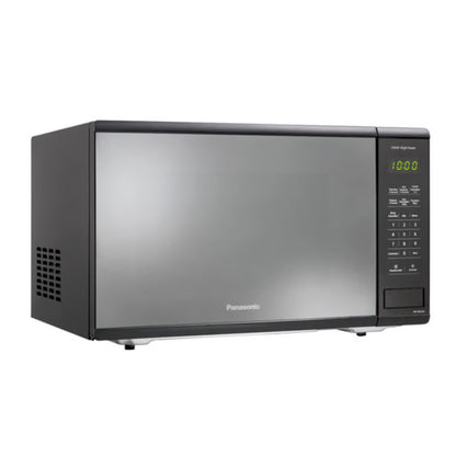 Horno microondas Panasonic 1.3 pies negro con puerta reflectante y panel táctil digital a la derecha.