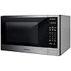Horno microondas Panasonic 1.3 pies acero inoxidable con panel digital negro y botones táctiles.