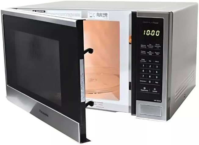 Horno microondas Panasonic 1.3 pies 1100W acero inoxidable con puerta abierta y panel digital negro.